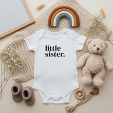 Load image into Gallery viewer, Little Sister baby bodysuit flat lay with neutral decor
