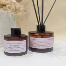 Load image into Gallery viewer, Diffuser with reeds and &#39;French Pear&#39; label on a neutral background
