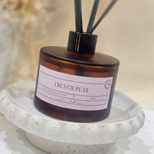 Load image into Gallery viewer, Diffuser with &#39;French Pear&#39; label on a speckled surface

