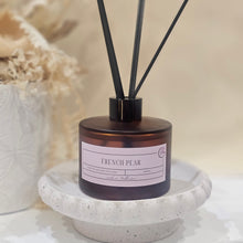 Load image into Gallery viewer, Reed diffuser with decorative stand on a neutral background
